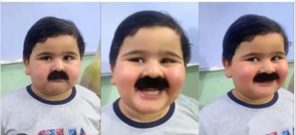 طفل عراقي تقمص دور الأب : يخطف قلوب المتابعين بلطافته وشاربه(فيديو)