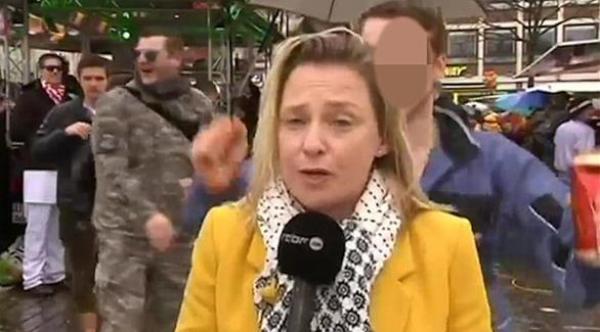 3 ألمان يتحرشون بمذيعة فرنسية في كرنفال كولونيا على الهواء